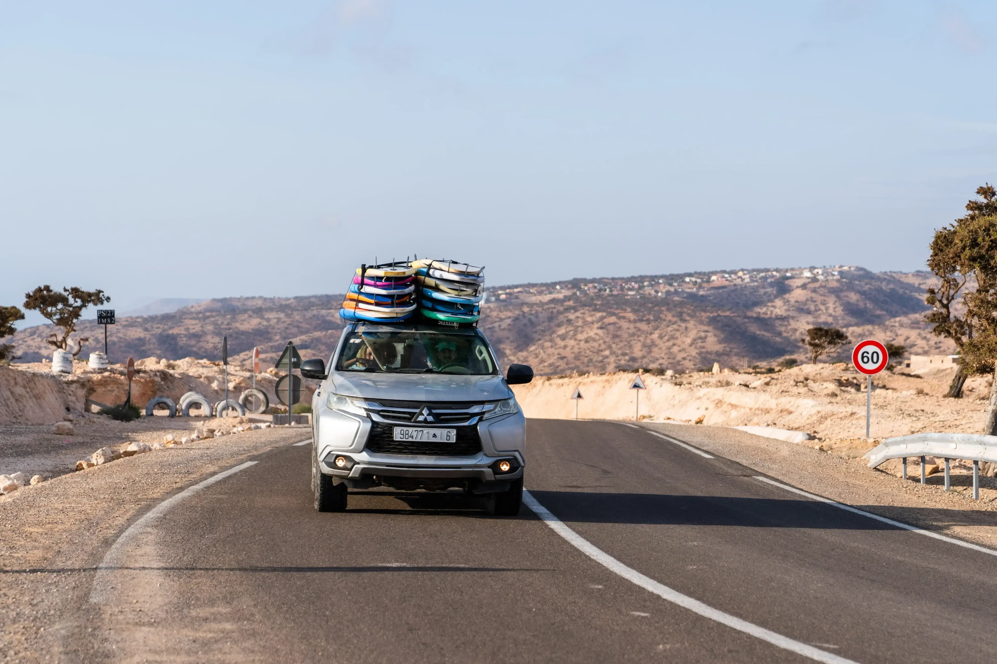 4x4 vehicle loaded with kitesurfing gear on a Moroccan beach